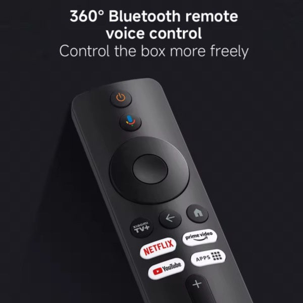 Black remote control with various buttons on a dark background