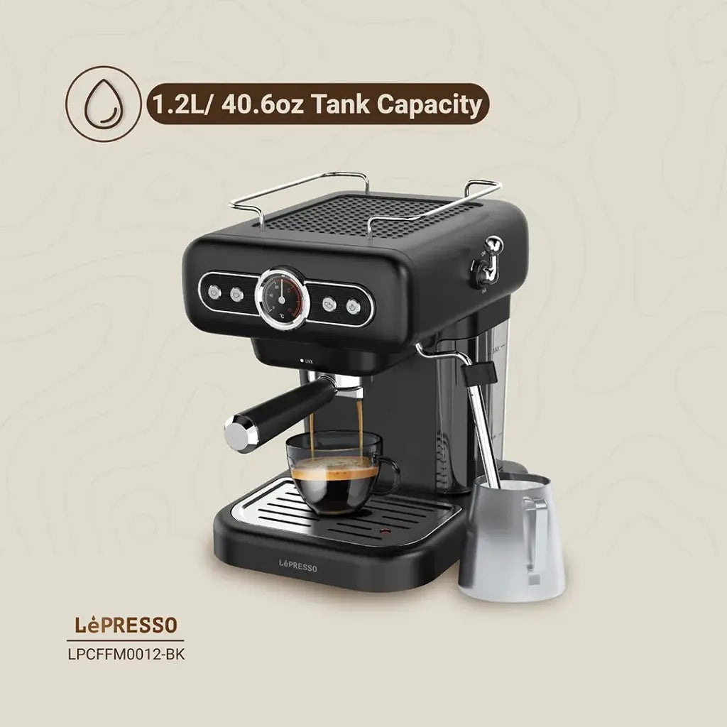 Home espresso coffee maker with pressure gauge and steam control.