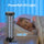 Ultraviolet light sterilizer next to a child sleeping with text indicating powerful UV light and coverage area.