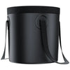 Black cylindrical bag with a strap on a white background