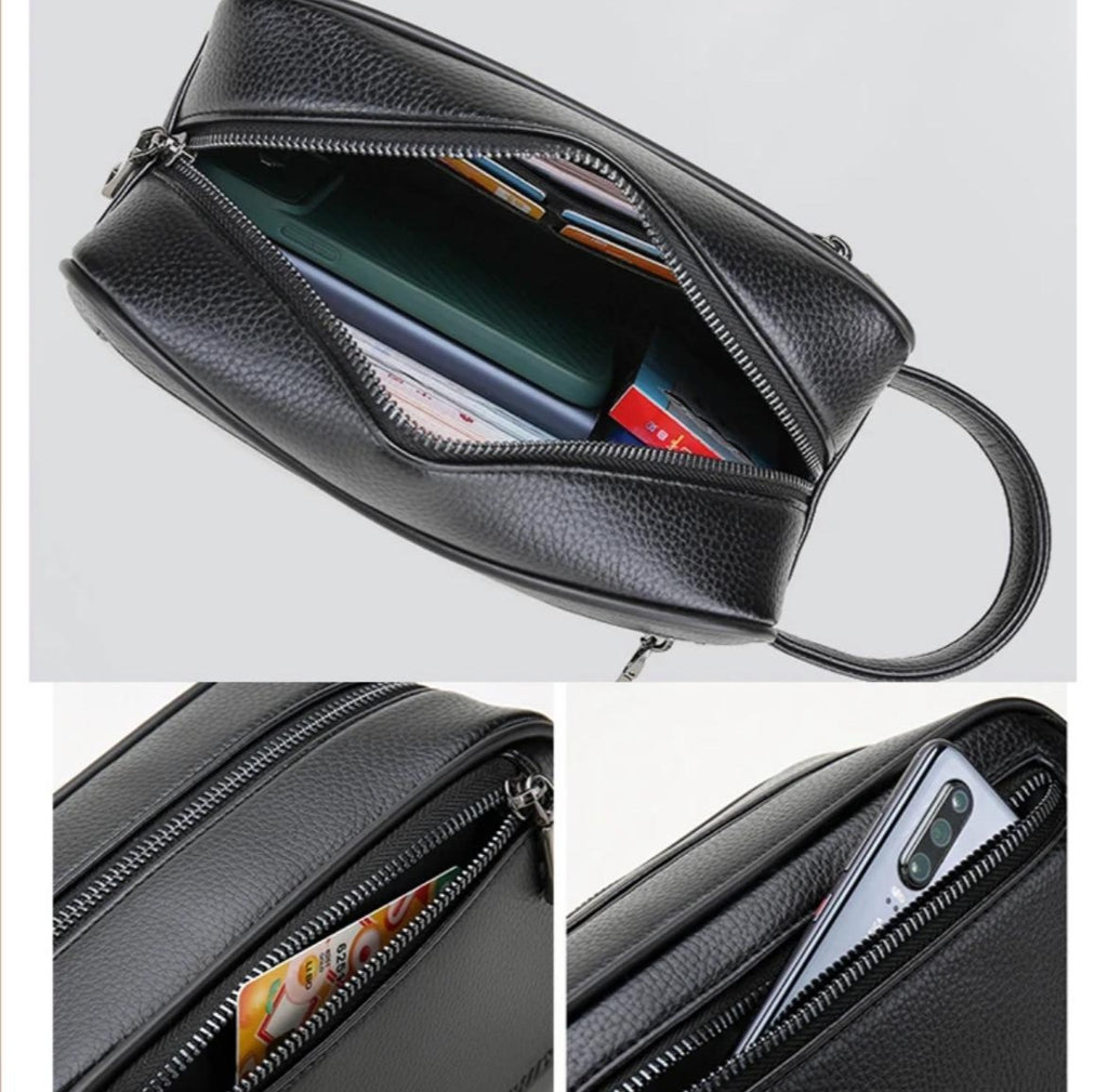 Multiple zippered compartments in brown leather organizer bag.	مقصورات متعددة بسحاب في حقيبة منظم جلدية بنية اللون.