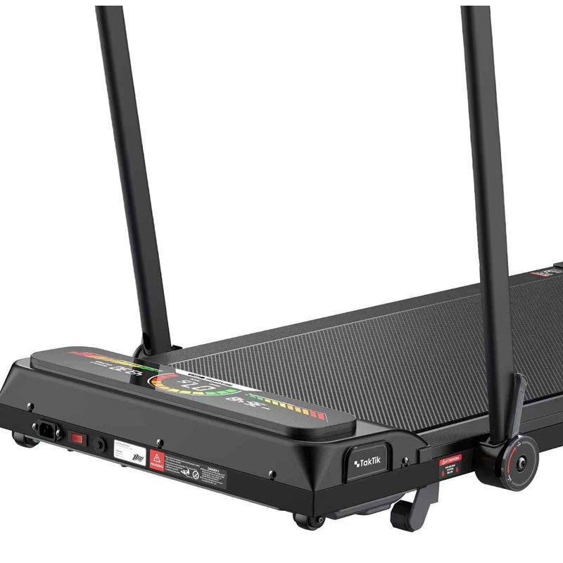 Foldable Taktik Pro treadmill in a small apartment space with wheels for easy moving.